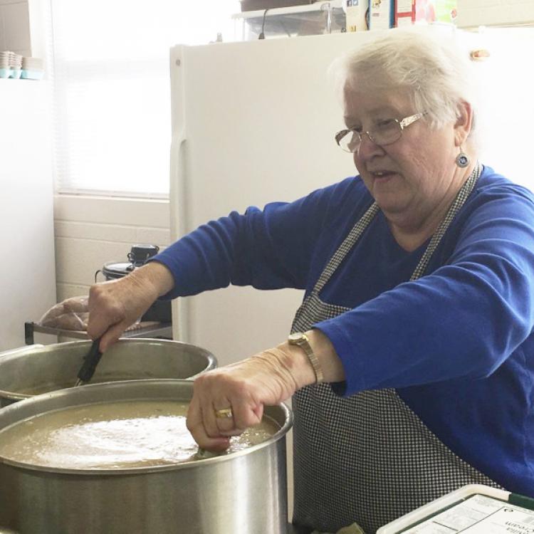  woman cooking soup